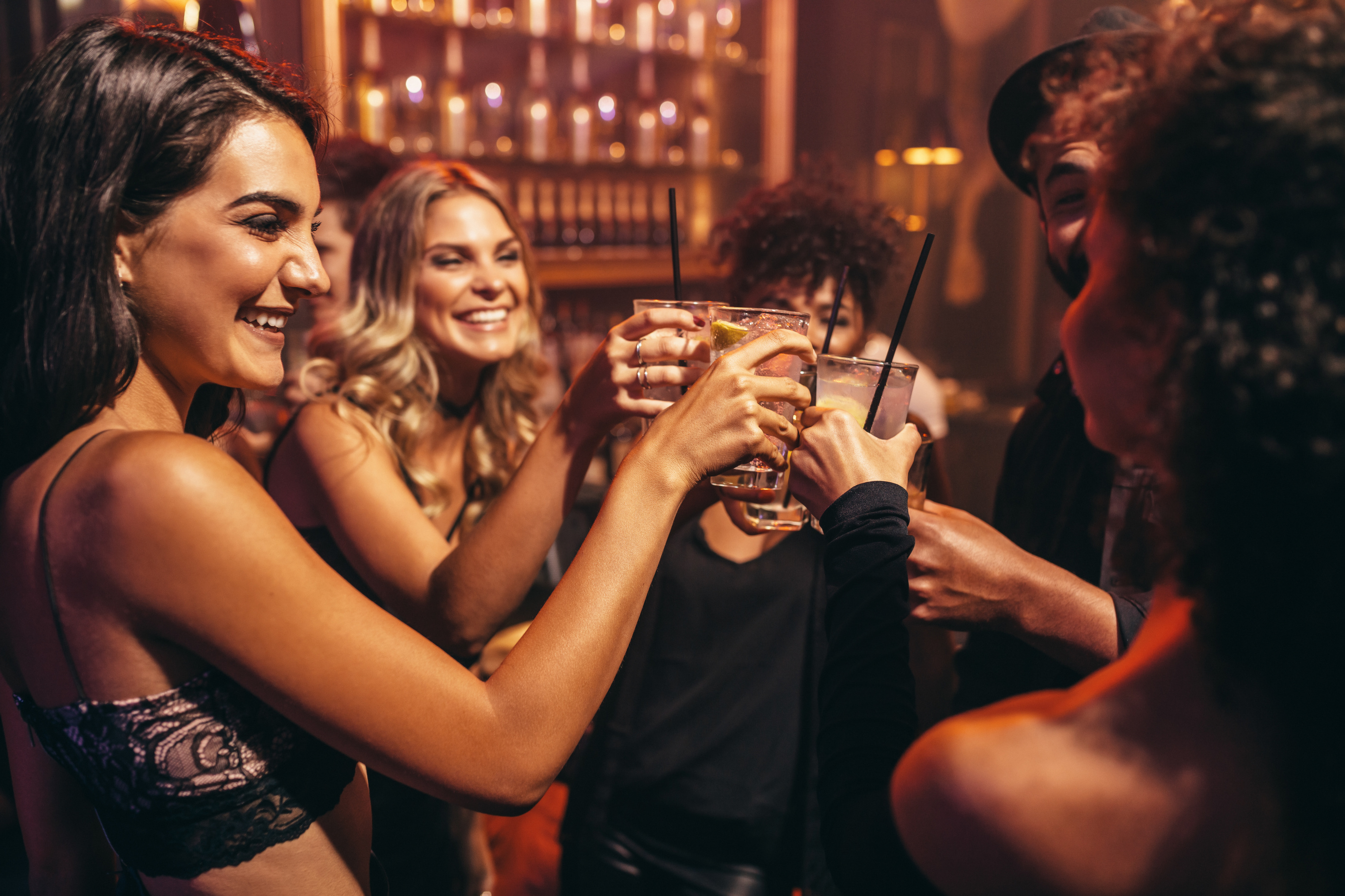 Young People with Cocktails at Nightclub